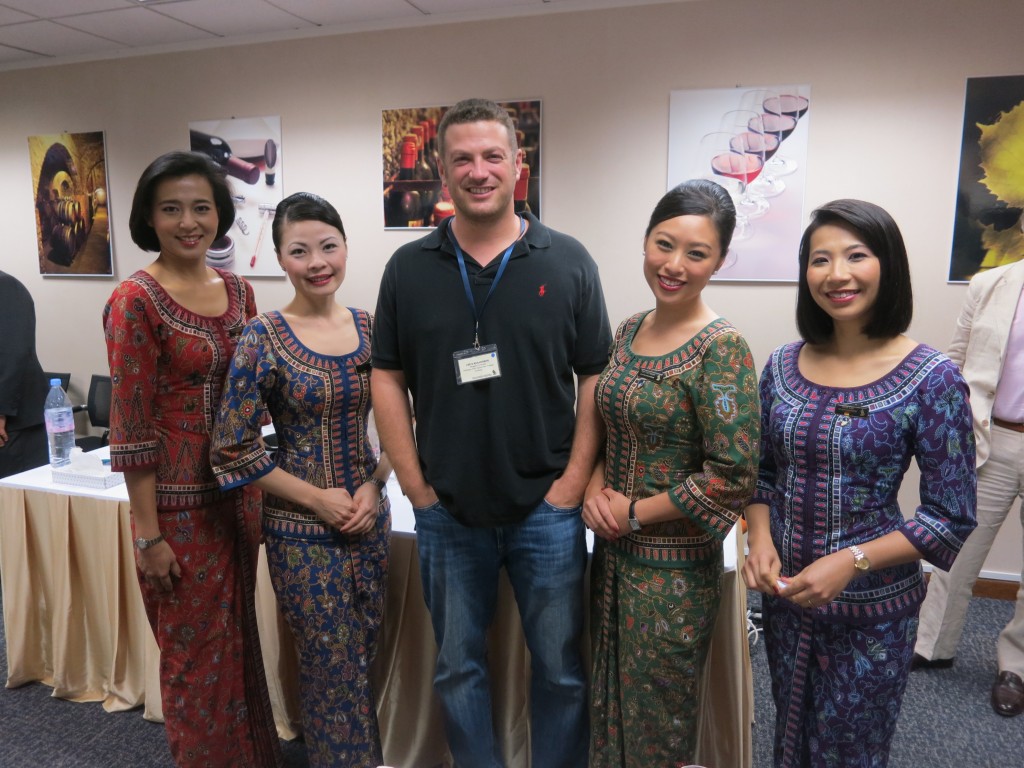 Lee Abbamonte with some Singapore Airlines cabin crew at an airline sponsored event in Singapore