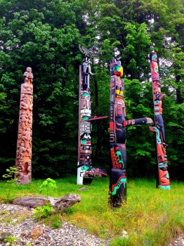 walking the seawall in stanley park, vancouver, british columbia, totem polls