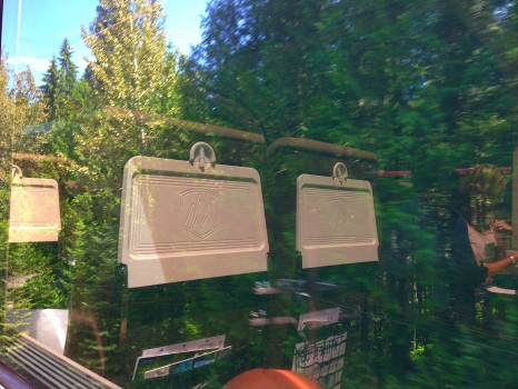 reflections in the windows of goldleaf class, Rocky Mountaineer, train, Canada, Vancouver, Jasper, British Columbia, Alberta