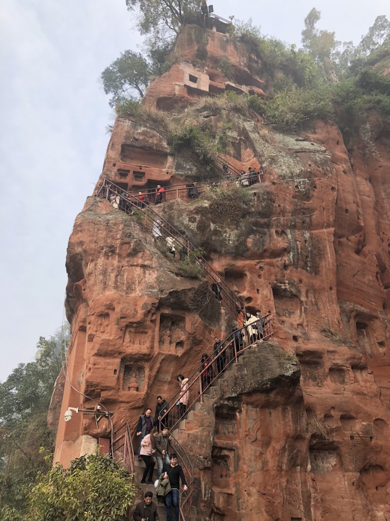 Climbing down 233 feet to the ground beneath Leshan Giant Buddha