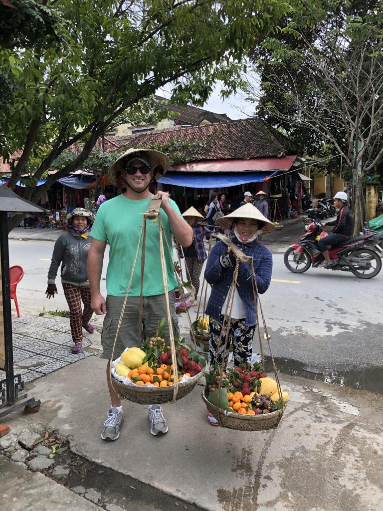 Trying my hand at selling fruit in Hoi An