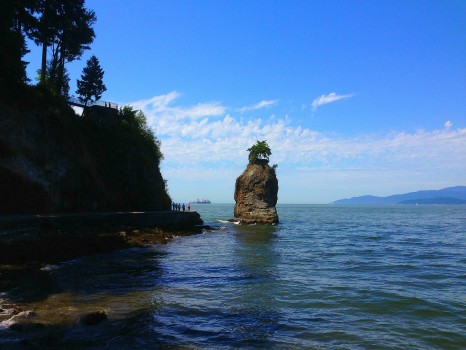 walking the seawall in stanley park, vancouver, british columbia, siwash rock