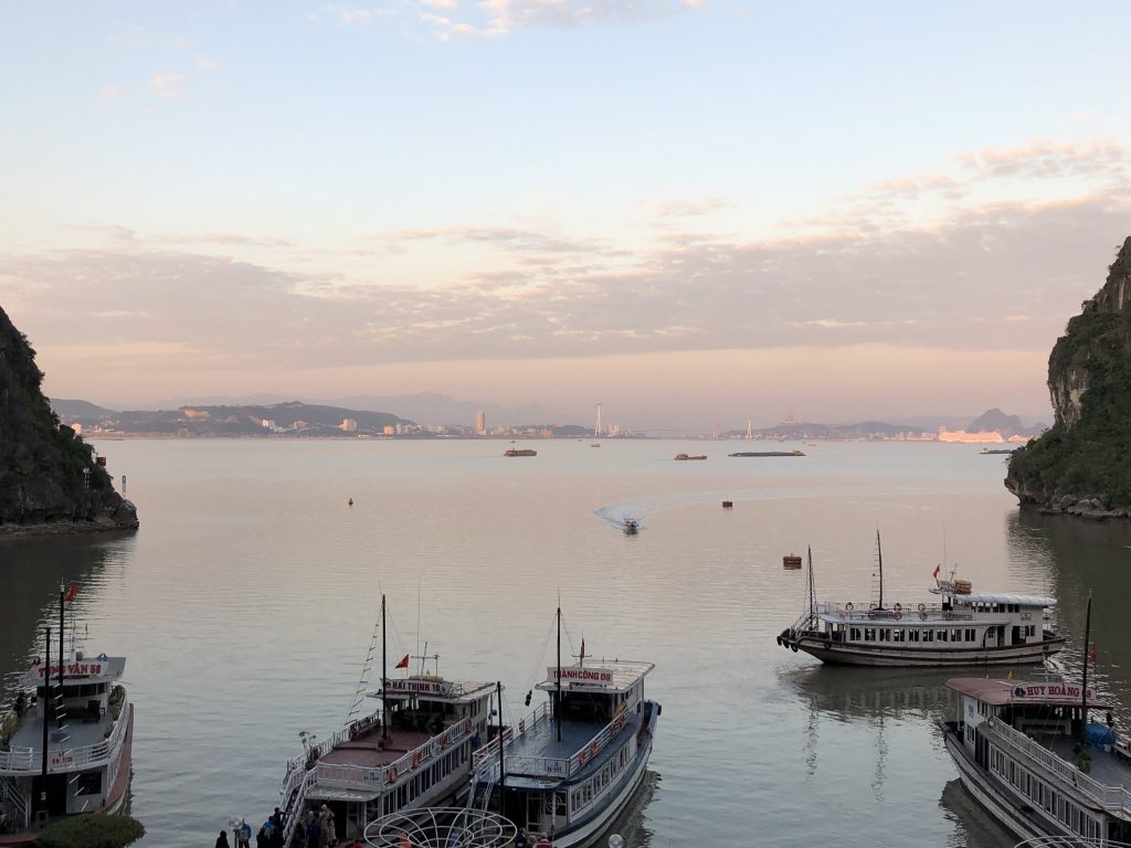 Ha Long City from just outside a cave as suns sets